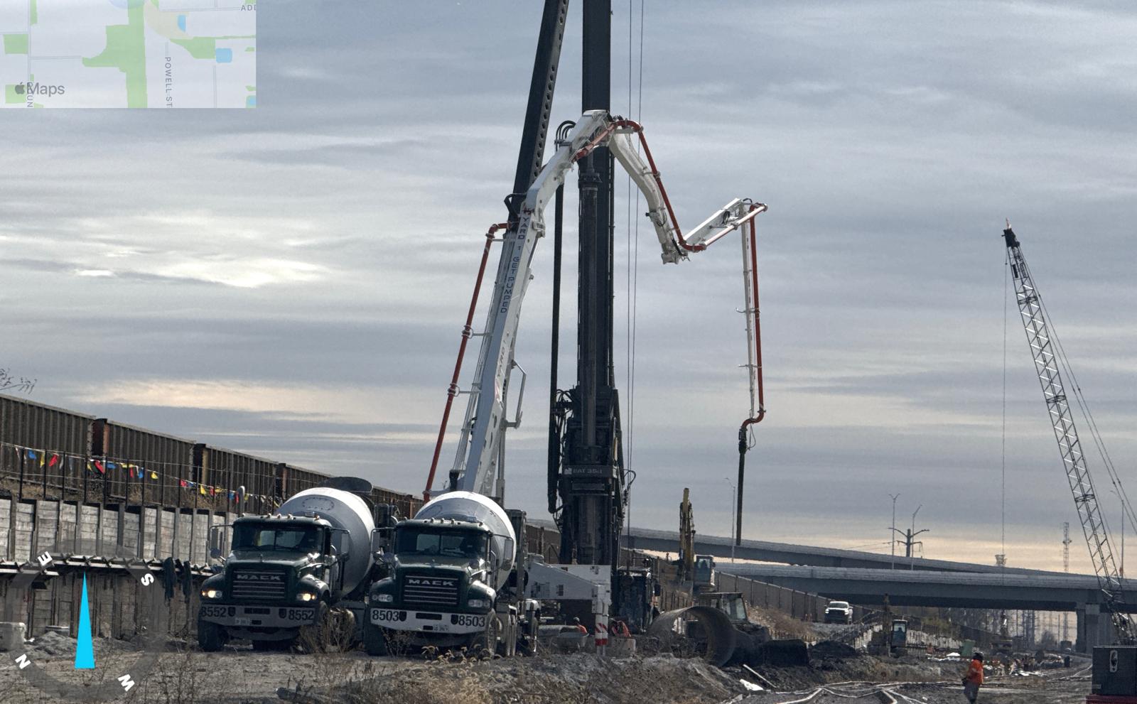 Road and highway infrastructure works with concrete pump and equipment.