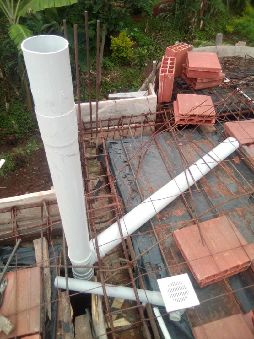 PVC plumbing and drainage pipes coordinated within slab reinforcement before concrete.