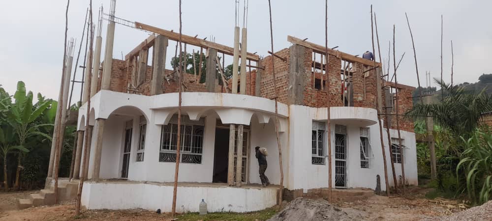 Two-storey residential building delivered by CHI-UG under construction in Uganda.